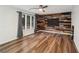 An empty room with luxury vinyl plank flooring, an accent wall and a ceiling fan at 3748 Woodrose Ct, Snellville, GA 30039