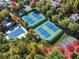 Enjoy the community tennis and basketball courts of this beautiful property surrounded by colorful fall foliage at 4465 Newhall Dr, Cumming, GA 30040