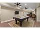 Basement rec room with a pool table, bar and hardwood floors at 4465 Newhall Dr, Cumming, GA 30040