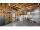 Unfinished basement featuring exposed wood beams, a door, and room for storage or customization at 4465 Newhall Dr, Cumming, GA 30040