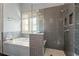 Bathroom with a walk-in shower featuring gray subway tiles at 4465 Newhall Dr, Cumming, GA 30040