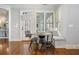 Cozy breakfast nook with cushioned seating and natural light from large windows at 4465 Newhall Dr, Cumming, GA 30040