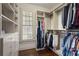 Custom walk-in closet with built-in shelving and ample storage space at 4465 Newhall Dr, Cumming, GA 30040