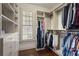 Well-organized walk-in closet with custom shelving and ample storage space at 4465 Newhall Dr, Cumming, GA 30040