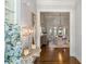 Elegant foyer showcasing hardwood floors and an open view to the dining room at 4465 Newhall Dr, Cumming, GA 30040