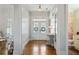 Inviting foyer with double doors, hardwood floors, and elegant decor at 4465 Newhall Dr, Cumming, GA 30040