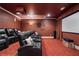 Home theater room with projector, screen, and leather recliner seating at 4465 Newhall Dr, Cumming, GA 30040