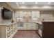 Basement kitchen featuring wooden floors, sleek appliances, granite countertops, and a wine rack at 4465 Newhall Dr, Cumming, GA 30040