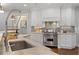 Close up of a kitchen featuring stainless steel appliances and ample counter space at 4465 Newhall Dr, Cumming, GA 30040