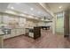 Basement kitchen featuring wooden floors, sleek appliances, granite countertops, and a pool table at 4465 Newhall Dr, Cumming, GA 30040