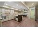 Open kitchen area featuring stainless steel appliances and access to a billiards room at 4465 Newhall Dr, Cumming, GA 30040