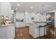 Spacious kitchen featuring white cabinetry, stainless steel appliances, and a large center island with seating at 4465 Newhall Dr, Cumming, GA 30040