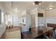 Office space featuring dark wood desk and cabinetry, bright light, and a mudroom entrance at 4465 Newhall Dr, Cumming, GA 30040