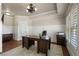 Bright home office with wainscoting, plantation shutters, and wood floors at 4465 Newhall Dr, Cumming, GA 30040