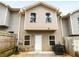 Rear exterior of home with fenced yard, patio, and central air conditioning unit at 1112 Highwood Ln, Atlanta, GA 30344