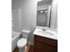 Clean bathroom with a white toilet, vanity, and shower-tub combination at 1112 Highwood Ln, Atlanta, GA 30344