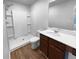 Contemporary bathroom with a walk-in shower, modern fixtures, and vanity with a white countertop at 1112 Highwood Ln, Atlanta, GA 30344
