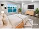 Serene staged bedroom with large windows, plush carpet, and modern furniture at 1112 Highwood Ln, Atlanta, GA 30344