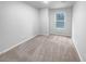 Inviting bedroom with neutral carpet and a view of nature outside the window at 1112 Highwood Ln, Atlanta, GA 30344