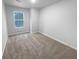 Cozy bedroom with neutral carpet and a view from the window at 1112 Highwood Ln, Atlanta, GA 30344