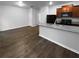 Modern kitchen features granite countertops, stainless steel appliances, and wood flooring at 1112 Highwood Ln, Atlanta, GA 30344