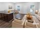 Bright, open-concept living room and kitchen with modern furnishings and hardwood style floors at 1112 Highwood Ln, Atlanta, GA 30344