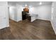 Spacious open concept living room and kitchen area with hardwood style floors at 1112 Highwood Ln, Atlanta, GA 30344