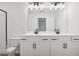 Modern bathroom showcasing a double vanity with sleek black hardware and a well-lit mirror at 2107 Stillhaven Pl, Douglasville, GA 30135