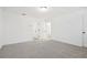 An empty bedroom is bright with neutral carpet and white walls, ready to be personalized at 2107 Stillhaven Pl, Douglasville, GA 30135