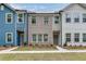 Modern townhomes featuring a combination of brick, siding, and well-manicured landscaping at 2107 Stillhaven Pl, Douglasville, GA 30135
