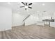 Open-concept living room featuring modern finishes, hardwood floors, and staircase to the upper level at 2107 Stillhaven Pl, Douglasville, GA 30135