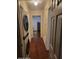 Narrow hallway with wood laminate flooring that includes laundry appliances at 2335 Boulder Se Rd, Atlanta, GA 30316