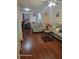 Inviting living area with cozy sofas, laminate wood floors, and a dining area in view at 2335 Boulder Se Rd, Atlanta, GA 30316