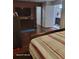 Spacious main bedroom with wood floors, TV, dresser, and an ensuite bathroom at 2335 Boulder Se Rd, Atlanta, GA 30316