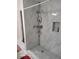 The shower is equipped with a showerhead and storage shelves, ensuring a practical and comfortable experience at 2335 Boulder Se Rd, Atlanta, GA 30316