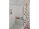 This shower features tiled walls and a shower curtain, providing a clean and stylish bathing space at 2335 Boulder Se Rd, Atlanta, GA 30316
