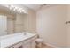 Bathroom featuring a vanity with sink, mirror, toilet, and standing shower at 3110 Chandon Ln, Lawrenceville, GA 30044