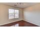 Bright bedroom featuring hardwood floors and a window with bright natural light at 3110 Chandon Ln, Lawrenceville, GA 30044