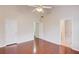 Spacious bedroom with high ceilings, hardwood floors, and three door openings at 3110 Chandon Ln, Lawrenceville, GA 30044