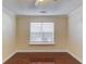 Bright bedroom with beautiful hardwood floors, neutral walls, and a ceiling fan at 3110 Chandon Ln, Lawrenceville, GA 30044