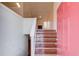Entryway with hardwood stairs leading to a bright living area with a fireplace at 3110 Chandon Ln, Lawrenceville, GA 30044