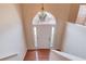 Bright foyer featuring hardwood floors, a decorative chandelier, and a white front door at 3110 Chandon Ln, Lawrenceville, GA 30044