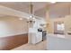 Open kitchen with stainless appliances, white cabinets, and a breakfast bar overlooking the living area at 3110 Chandon Ln, Lawrenceville, GA 30044