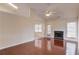 Spacious living room with a fireplace, hardwood floors, and large windows at 3110 Chandon Ln, Lawrenceville, GA 30044