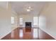 Open living room with hardwood floors, fireplace, and a view to the backyard at 3110 Chandon Ln, Lawrenceville, GA 30044
