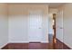 A brightly lit interior room with hardwood floors and white doors at 3110 Chandon Ln, Lawrenceville, GA 30044
