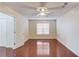 A bright room featuring hardwood floors, a window, and a ceiling fan at 3110 Chandon Ln, Lawrenceville, GA 30044
