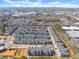 Community aerial shot featuring townhomes, streets, pond and surrounding area under a sunny sky at 355 Walker Avenue, Roswell, GA 30076
