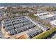 Overhead view of community featuring townhomes, roadways, and neighborhood amenities at 355 Walker Avenue, Roswell, GA 30076