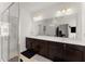Bright bathroom with double sink vanity, large mirror, and glass-enclosed shower at 355 Walker Avenue, Roswell, GA 30076